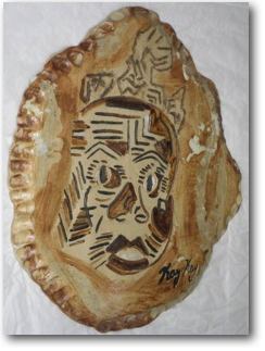 wall plaque of baby on stone with brown and black decoration